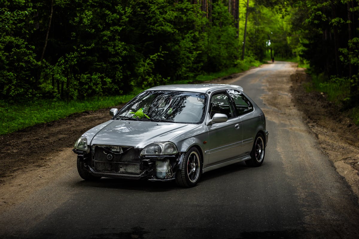 A Silver car on the Road