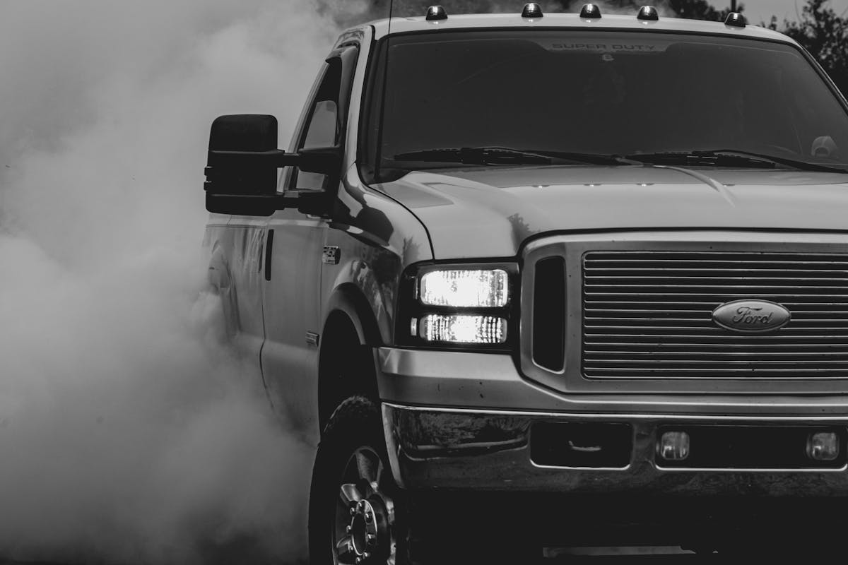 Grayscale Photo of Ford Pickup Truck