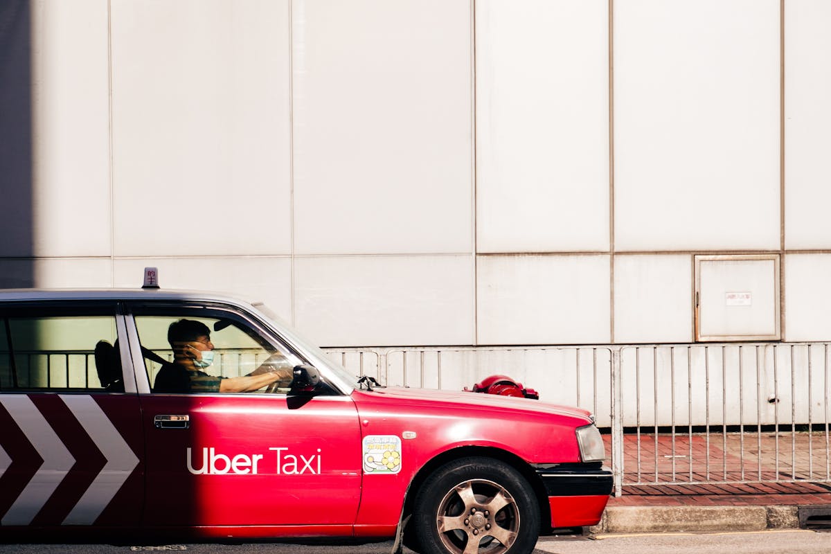 Red Taxi in Hong Kong Sunlight